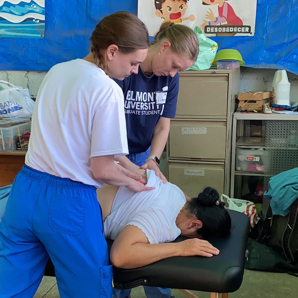 Belmont students work with a patient in Guatemala