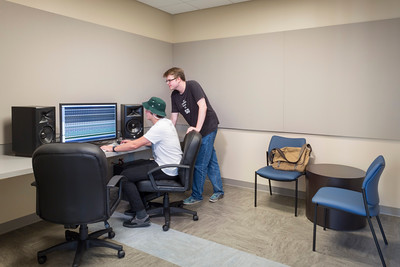 Students editing a project in an editing suite.