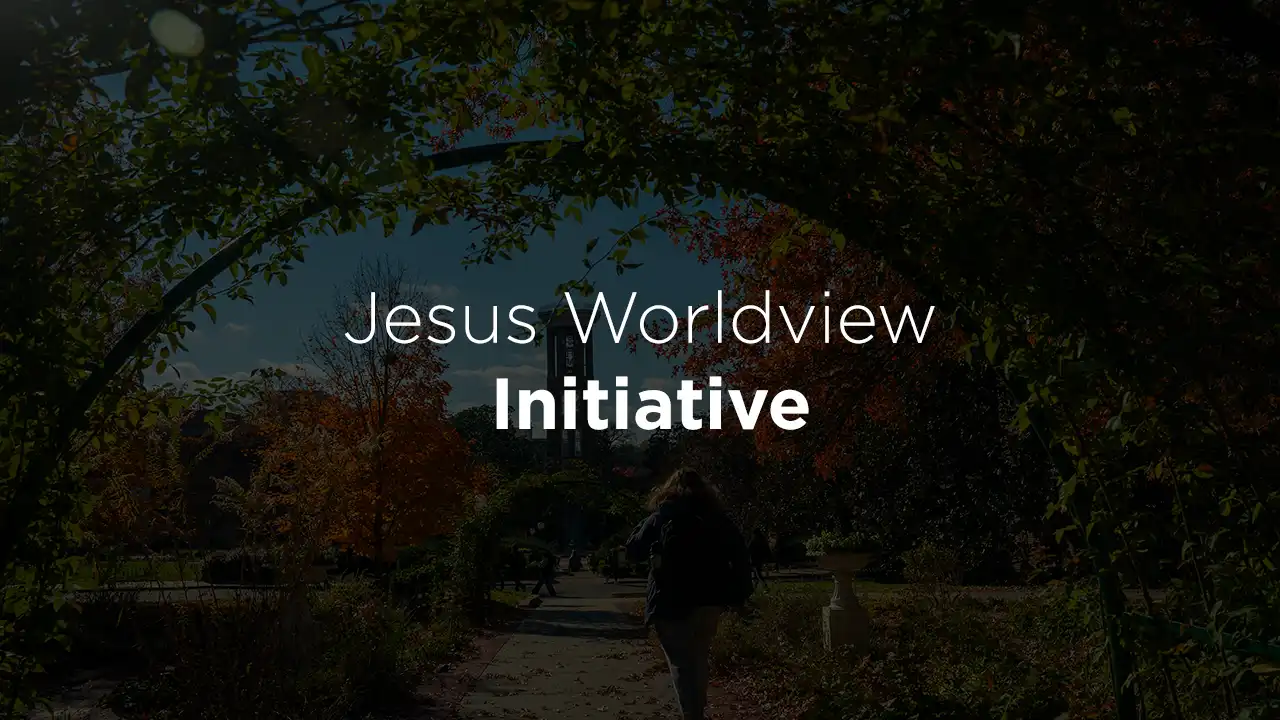 A photo of campus in the fall with the words Jesus Worldview Initiative