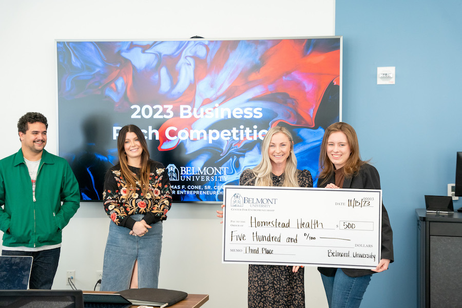 Students presented with third place check