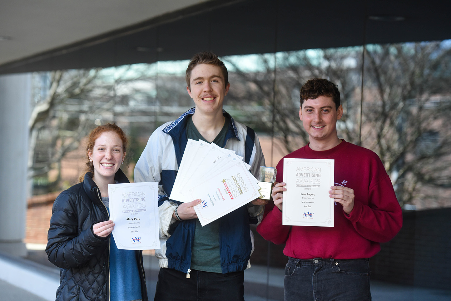 Students Holding certificates of their addy award