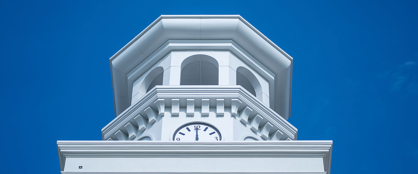 The clock tower atop the Jack C. Massey Center
