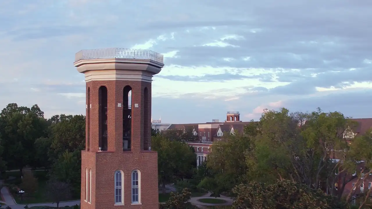 An aerial photo of Belmont's campus with Nashville in the distance