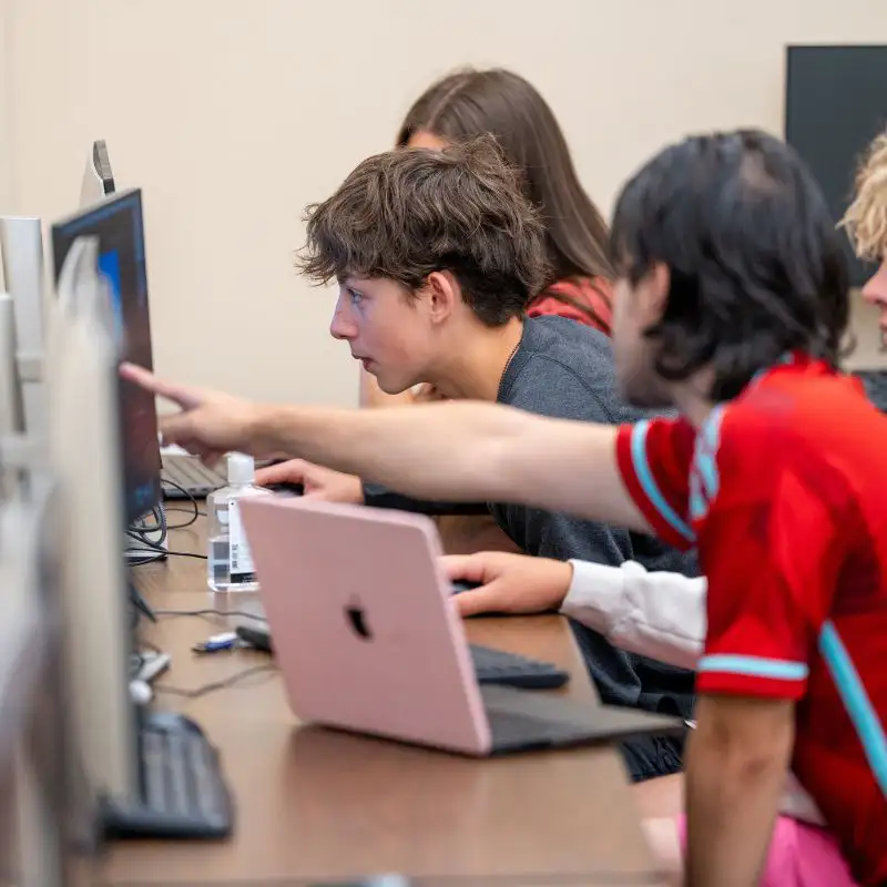 Students working together on computers.