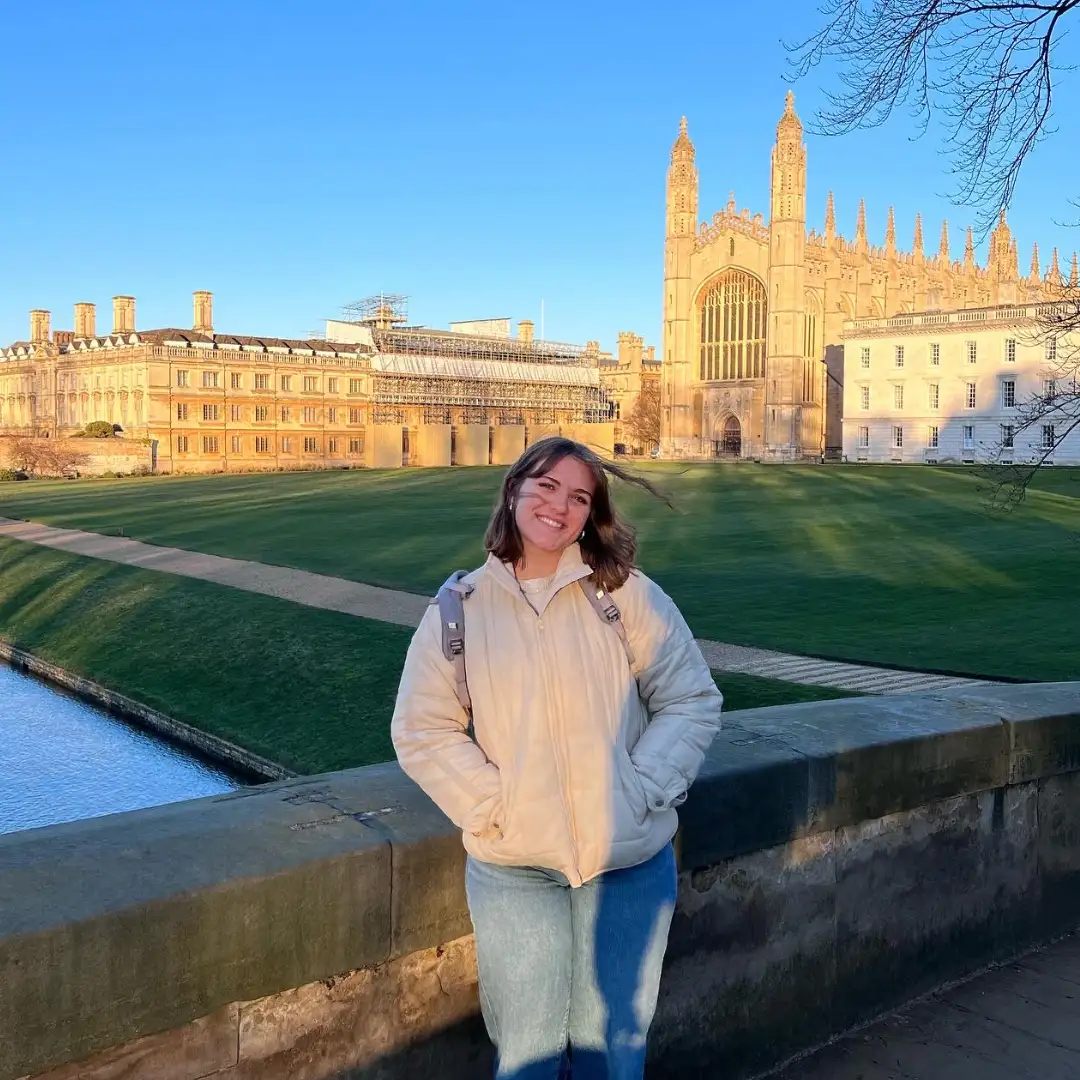 Student Gwen Butler poses in front of Cambridge University