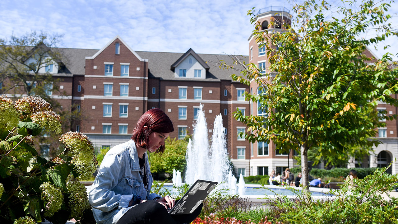 A student working on her laptop