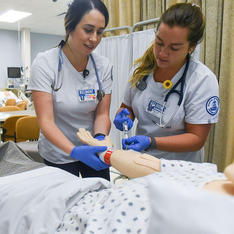 Nursing students working in a simulation lab