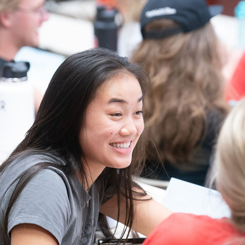 A student engaged in a conversation in a What's Your Why class.