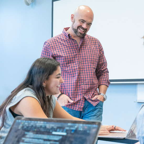 Students listen to professor during class