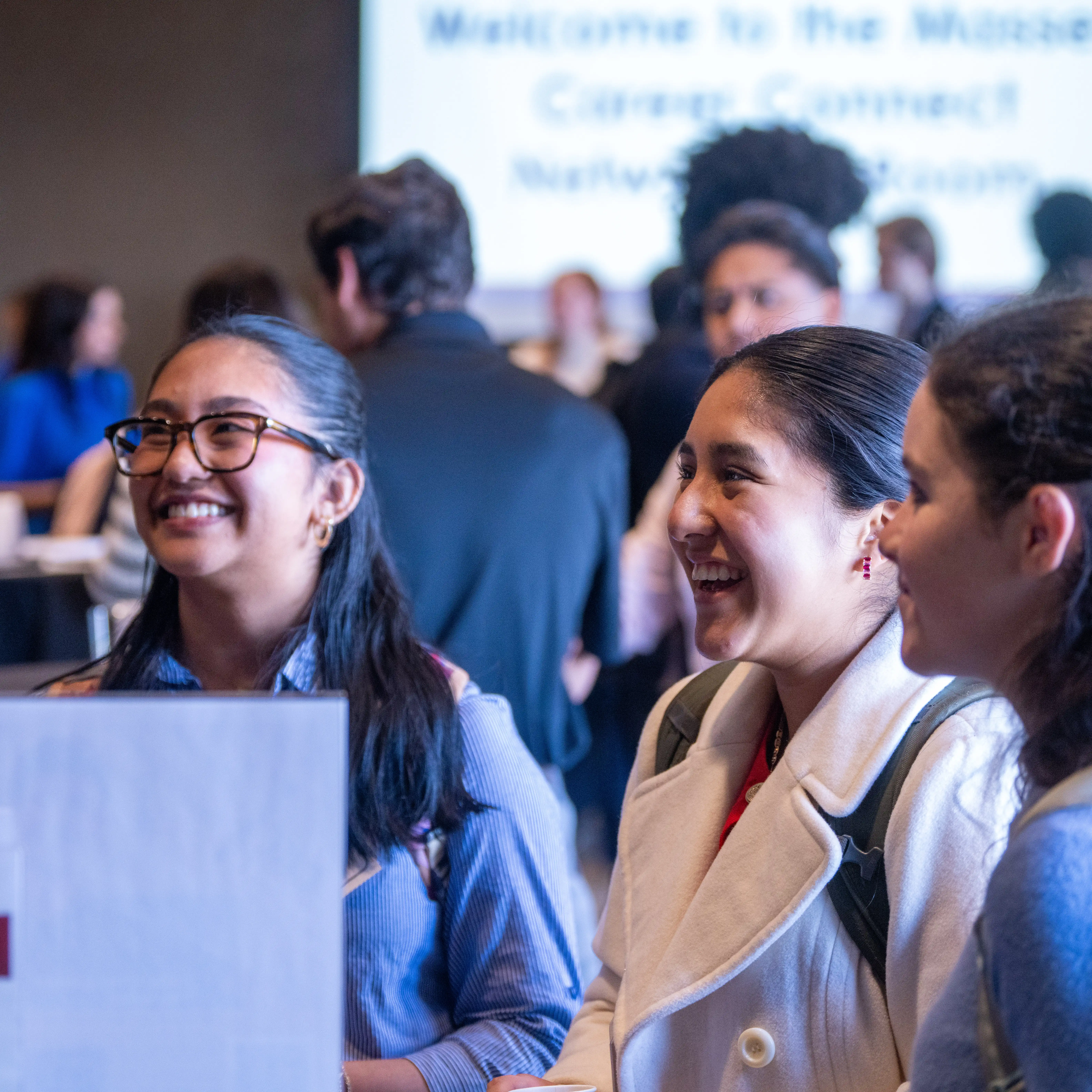 Students connect and network during a career fair, engaging with employers and industry professionals while exploring internships, career opportunities and professional connections.