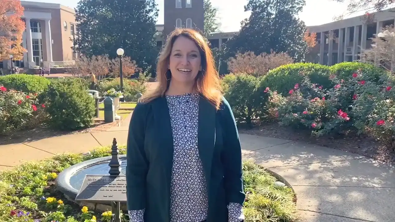 Professor Leslie Mann smiling and talking in a video