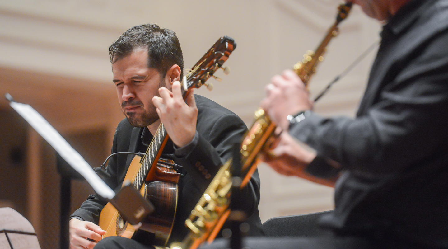 Music Faculty plays guitar