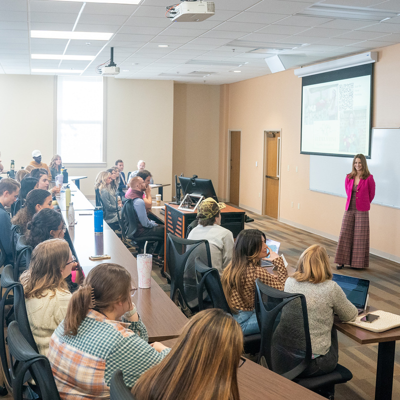 Students sit in full classroom during class lecture