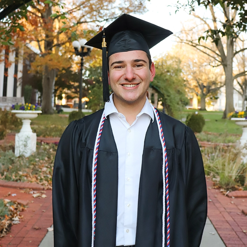 Quinn Saleik in a graduation cap and gown