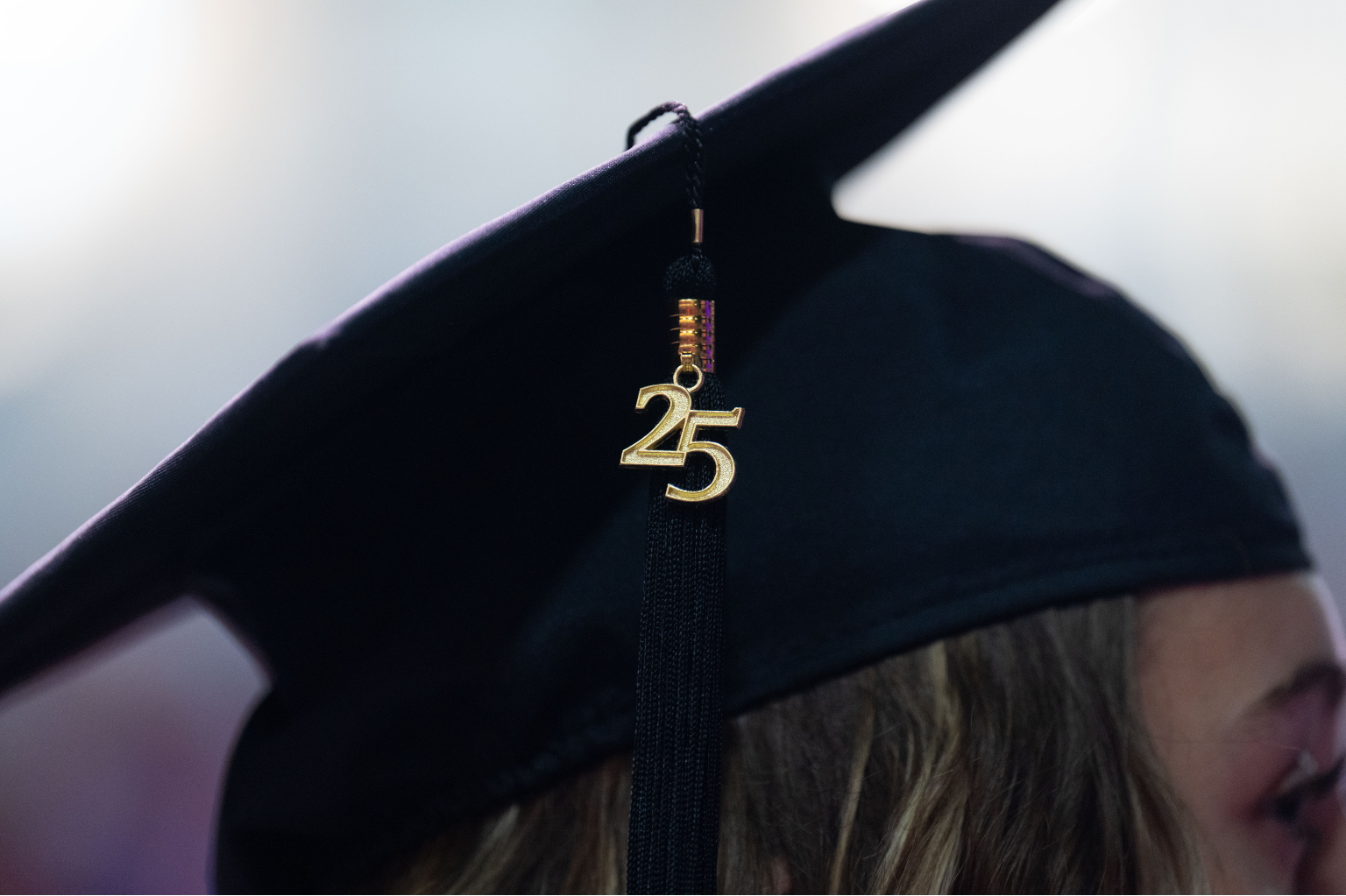 Photo of a graduating students cap with the year '25 on the tassel