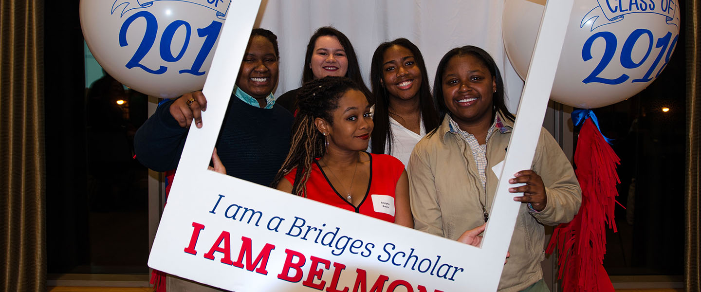 Five Bridges to Belmont Scholars posing for a photo in a photo frame