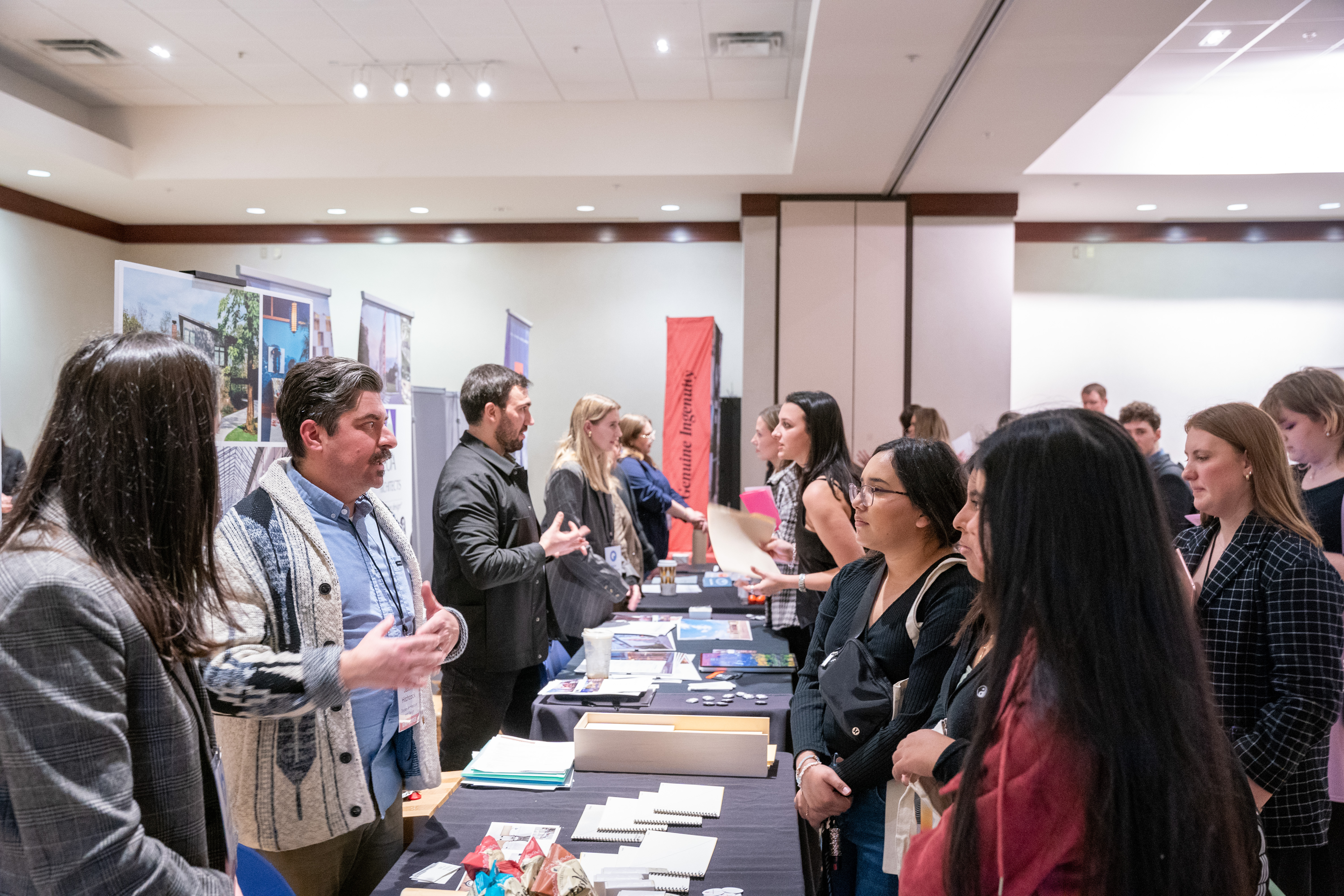 Image of students and employers at a career fair.