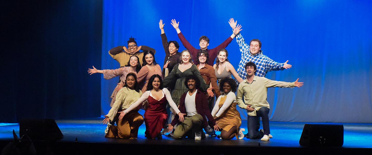 Students hit ending pose in performance during the freshman showcase