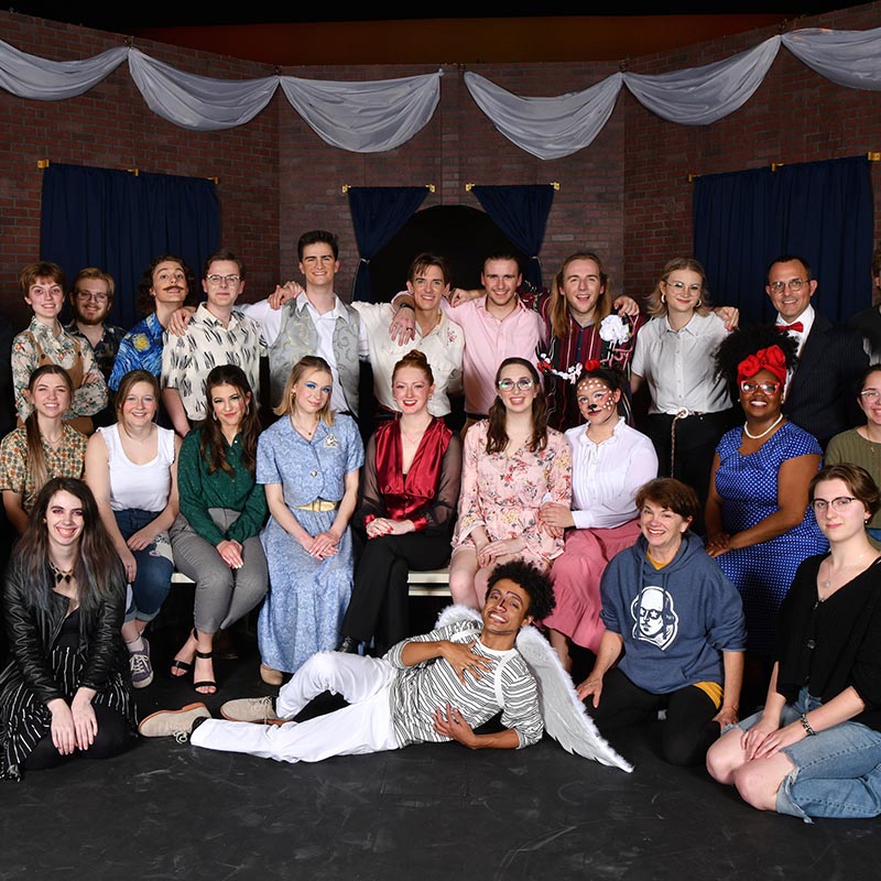 Theatre students pose for picture on stage of local professional theatre