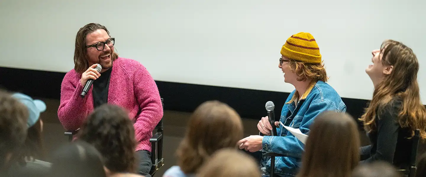 Belmont Alum Gabe Simon and interviewer engaged in a panel discussion on stage.