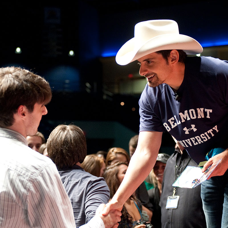 Brad Paisley shaking the hand of a student