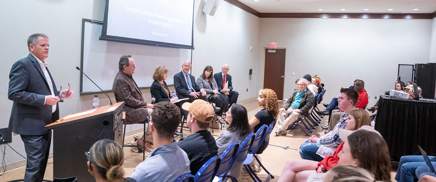 A large event where a panel is discussing a topic