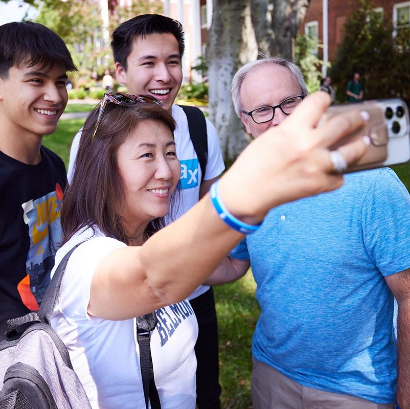 A family poses for a selfie.