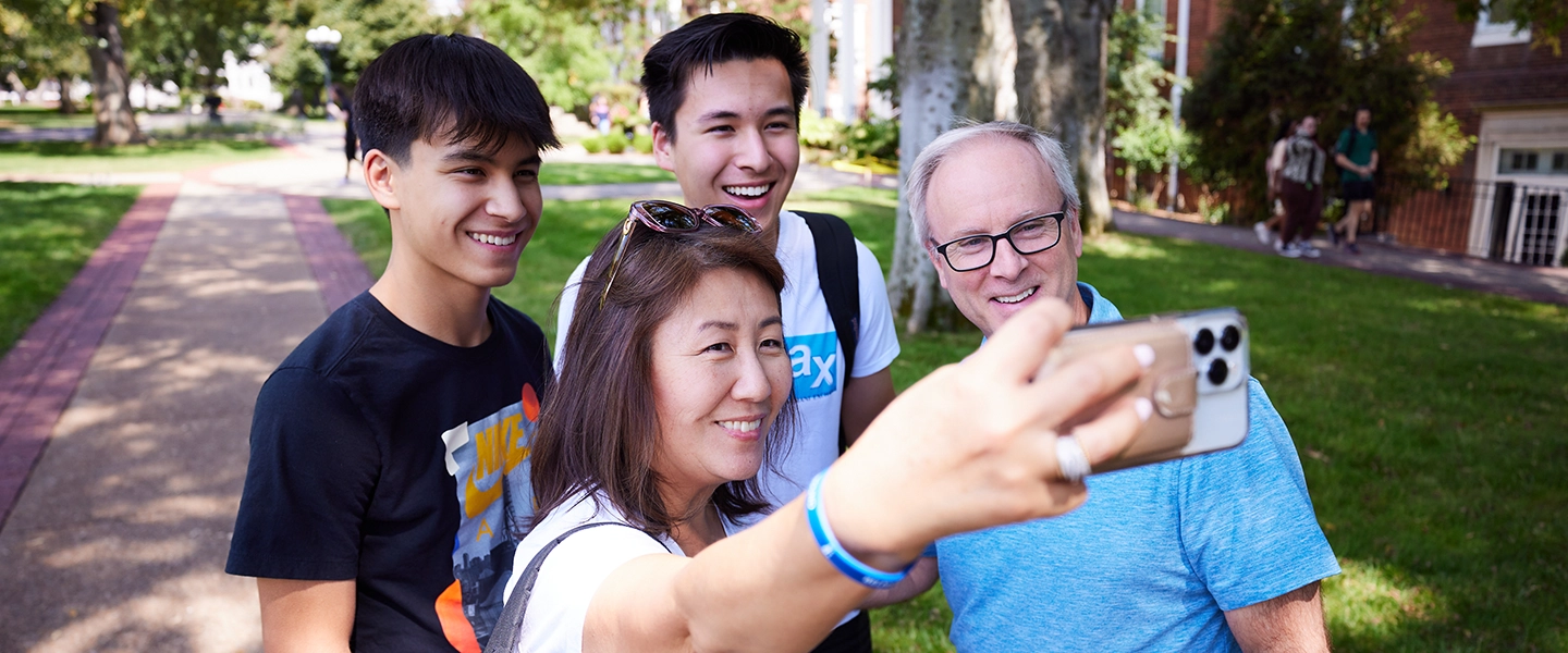 A Belmont family stops to take a photo on campus
