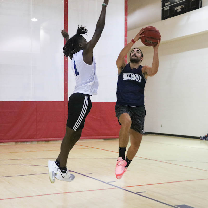 Student taking a break from playing Intramural Basketball