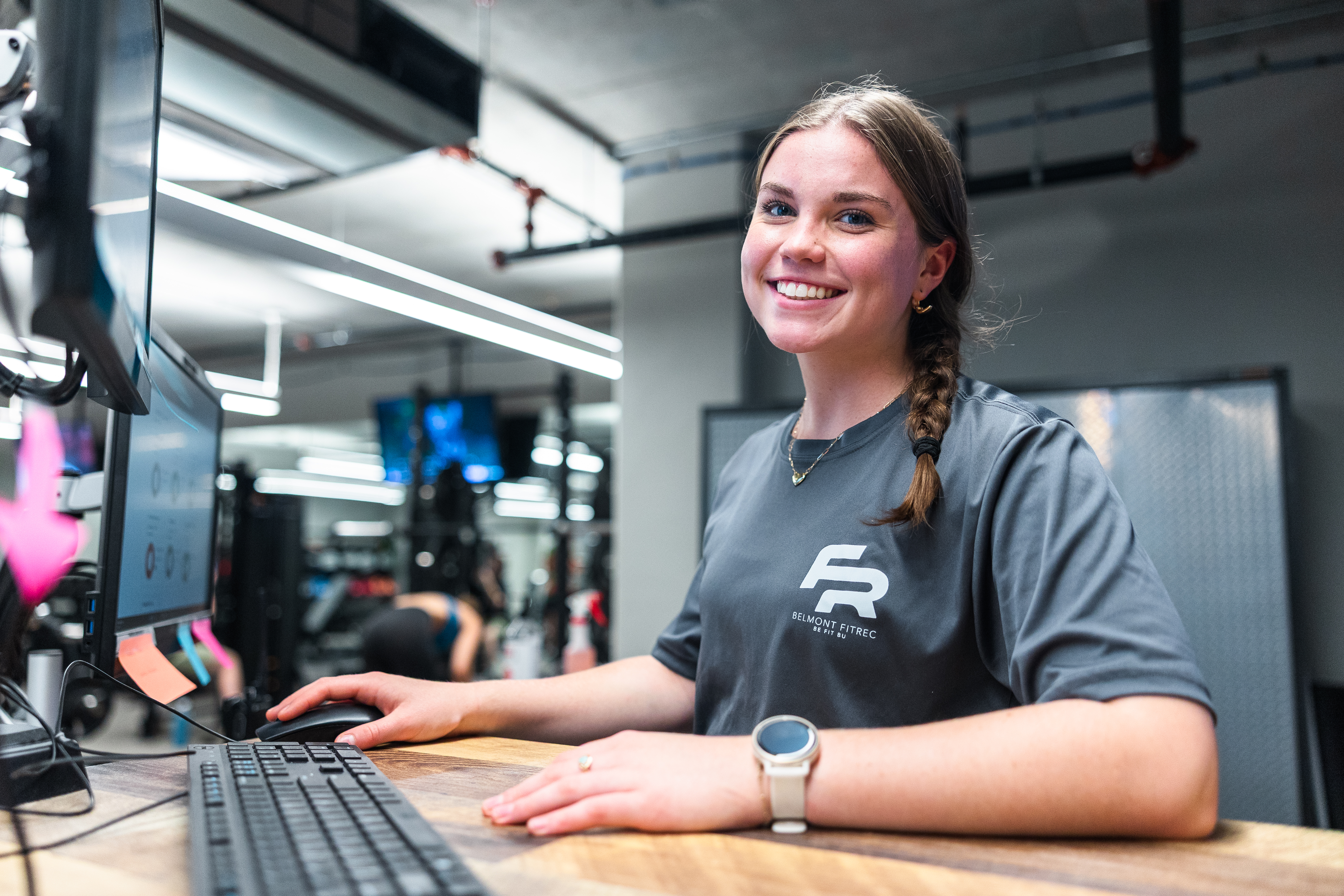 A student employee working at a desk