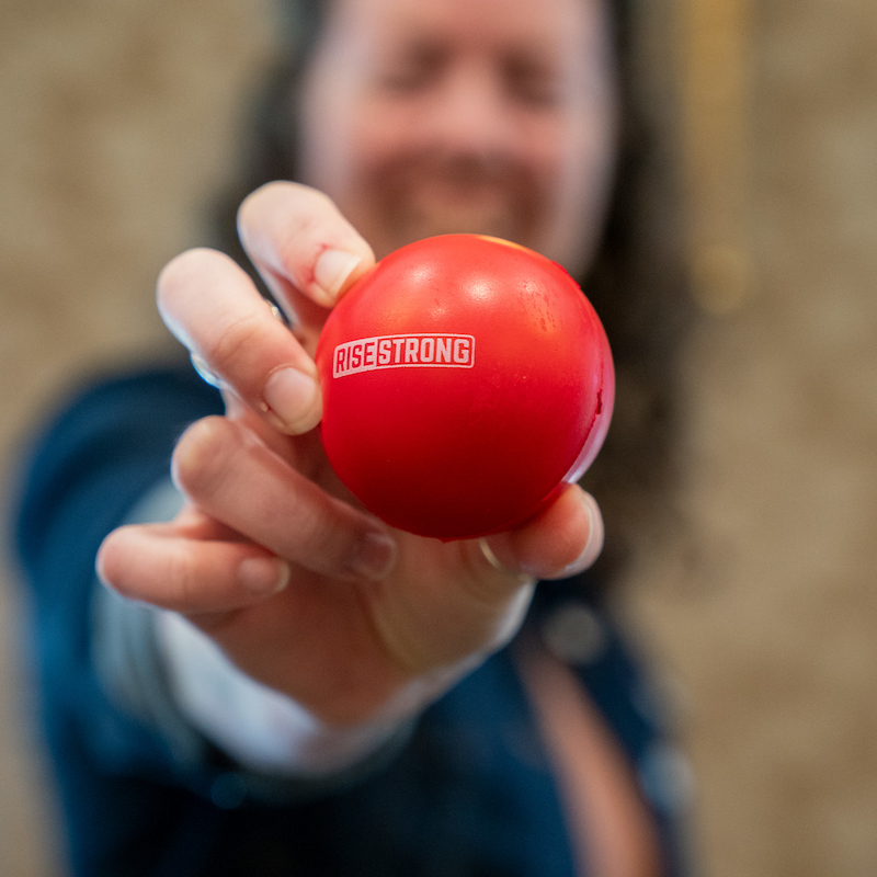 Man holding rise strong ball