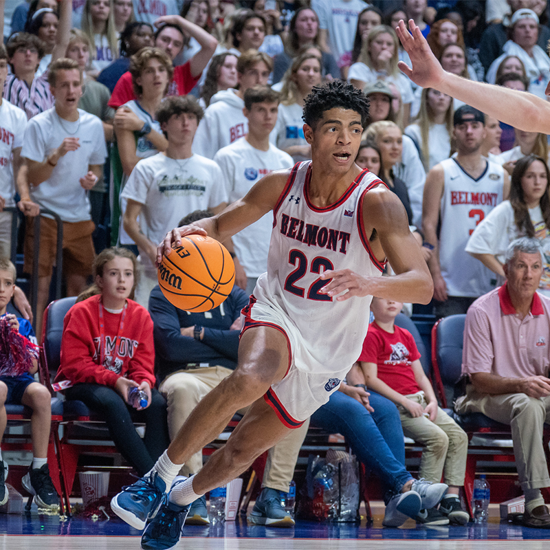 Belmont Men's Basketball student-athlete driving towards the basket during men's basketball game in the Curb Event Center.