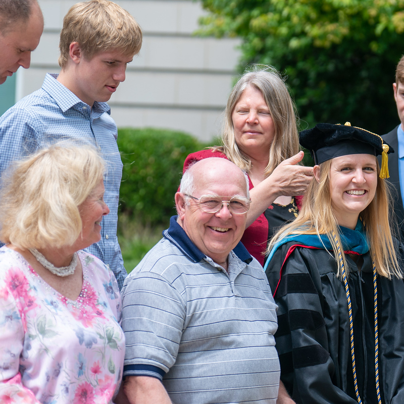 A photo of graduating Belmont student and their family after commencement at Belmont University 