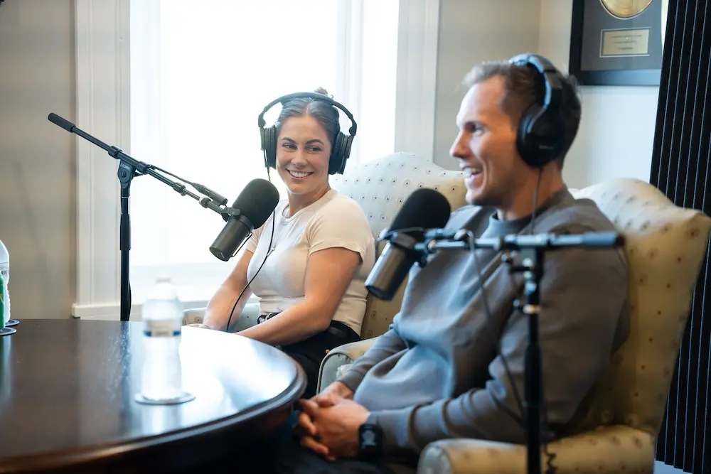 Johnson and East recording the podcast episode