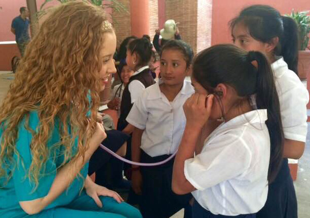 A student working with children in another country
