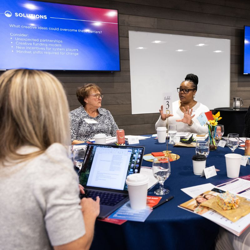 Women talking around a table