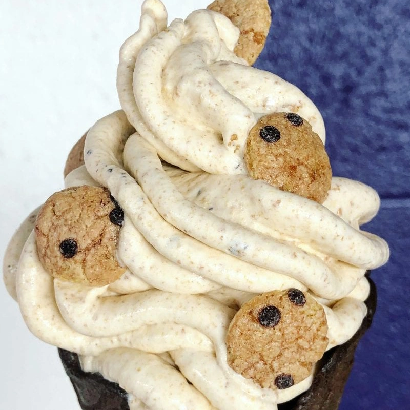 An image of soft serve ice cream with chocolate chip cookies in it.