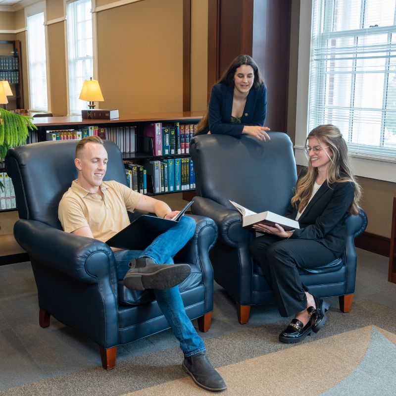 Two students working together in the Law Library