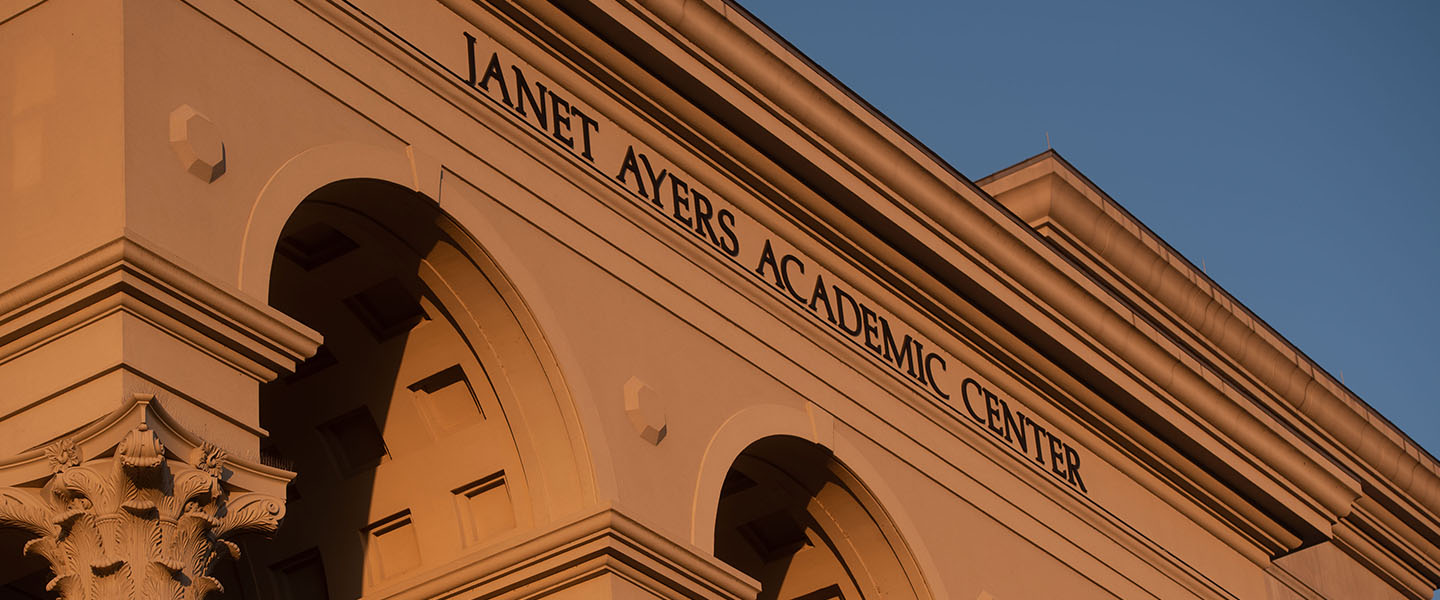 A sunrise view of the Janet Ayers Academic Center