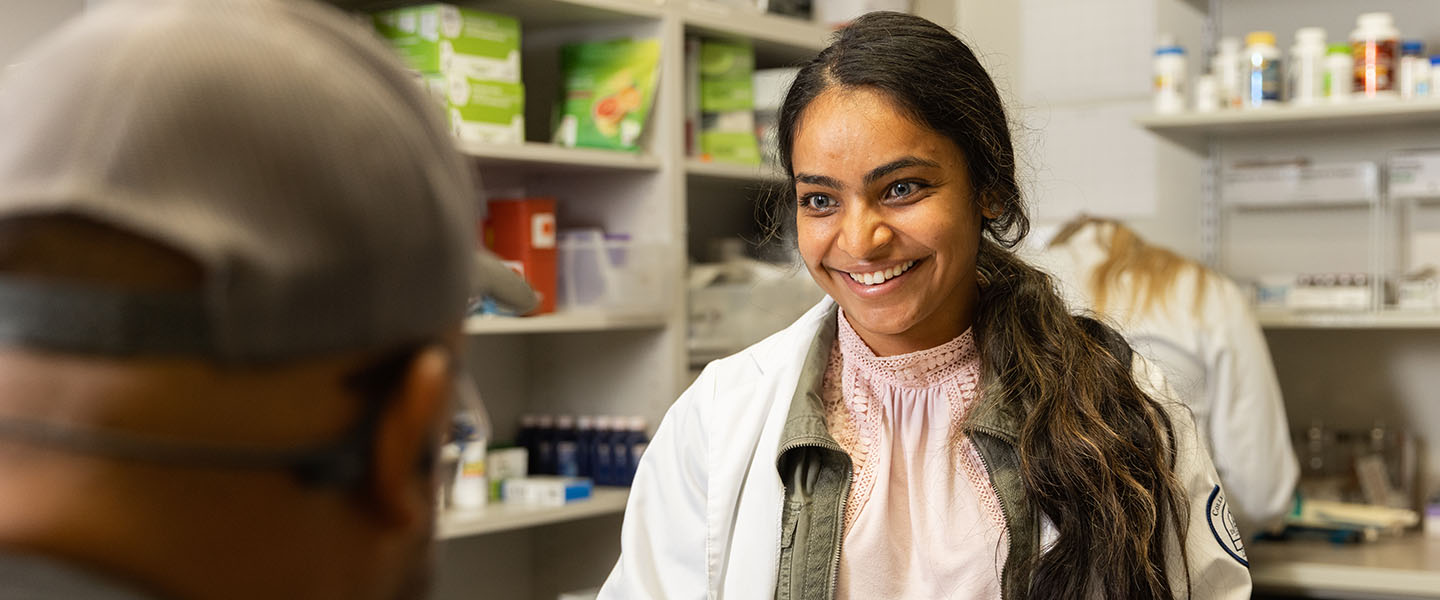 Medical student talking with a patient with a smile