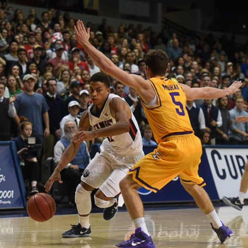 Belmont basket ball player playing Lipscomb player during battle of the boulevard