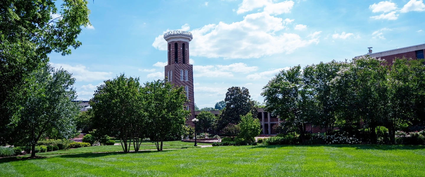 Belmont bell tower on a summer day with green lawn