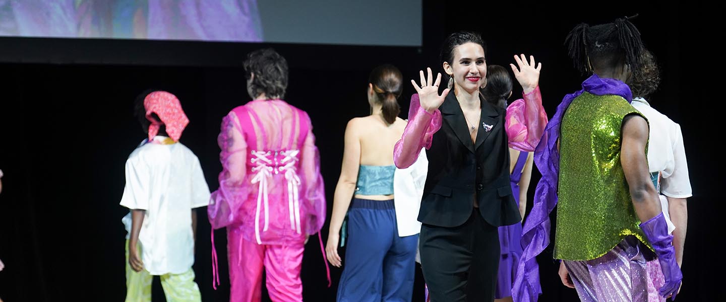 Fashion Design student walks in with their designs at annual fashion show