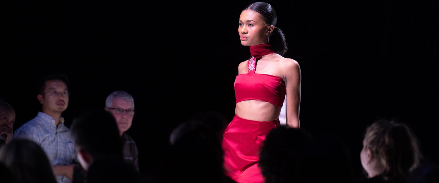 Model walks runway and annual student fashion show