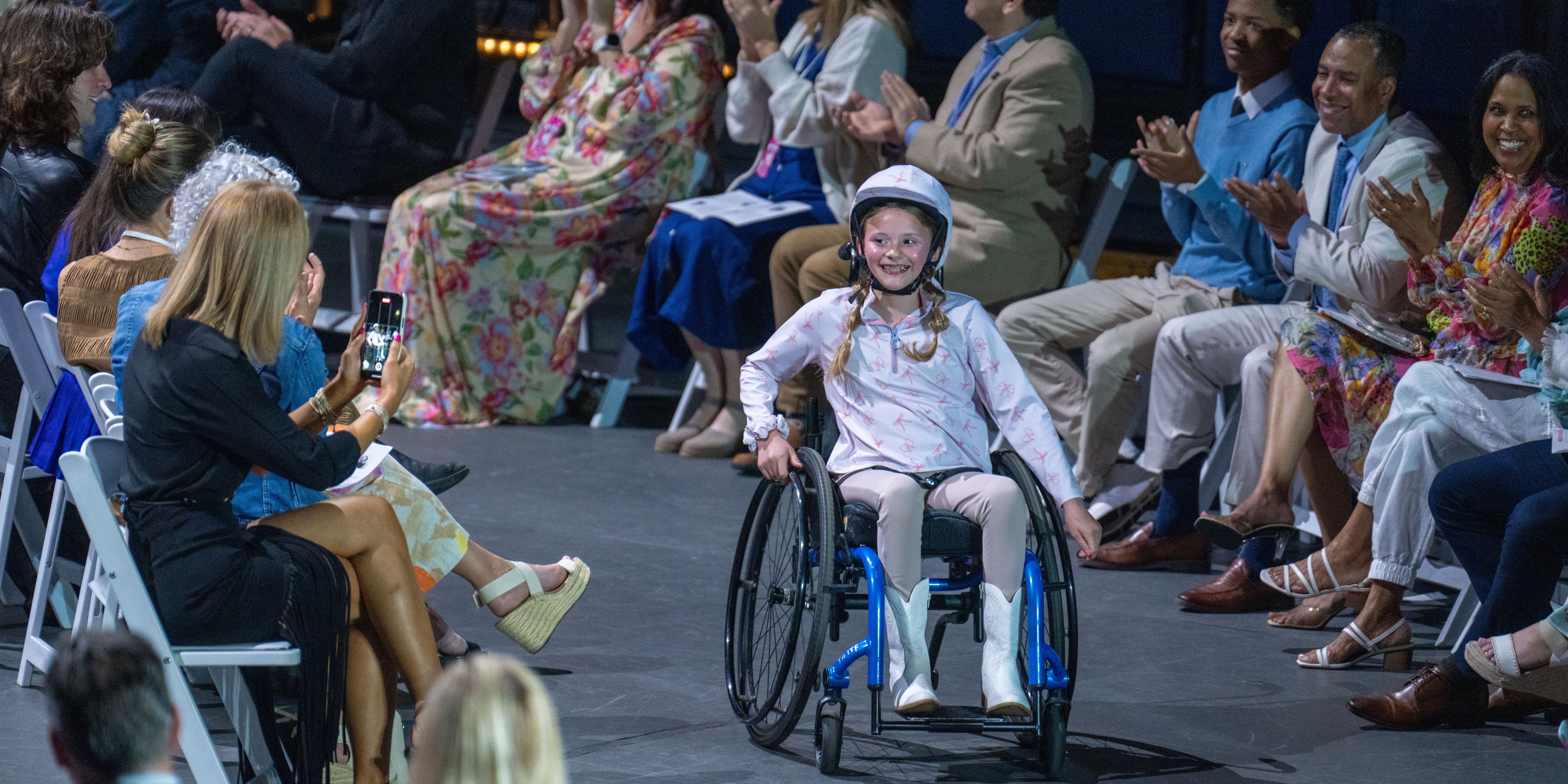 Fashion design student shows off model and design during fashion show