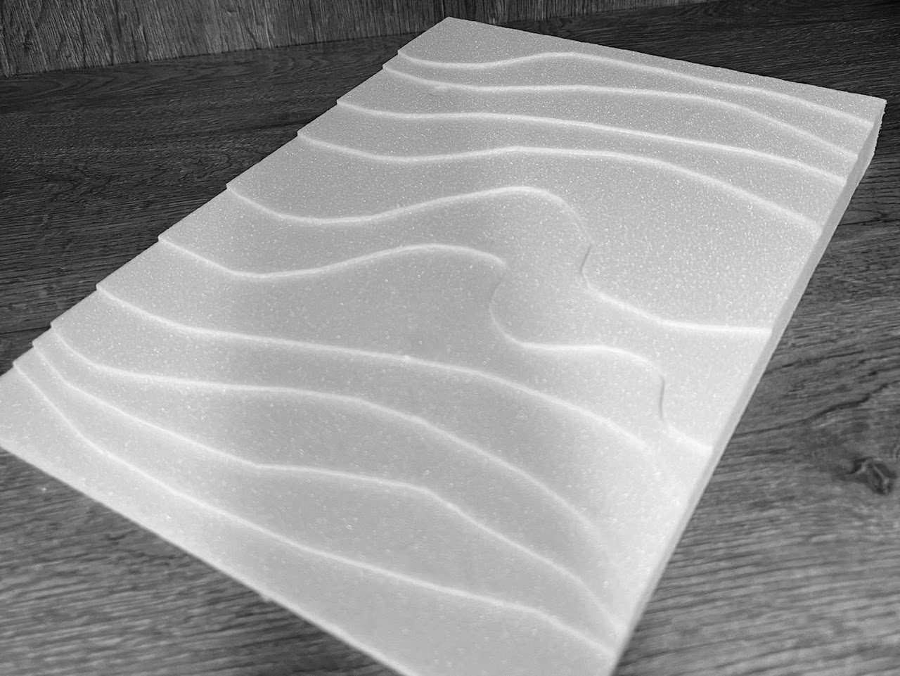 A flat surface with waves in it