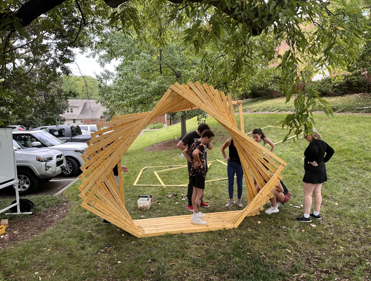 A team assembling the Twirl installation outside
