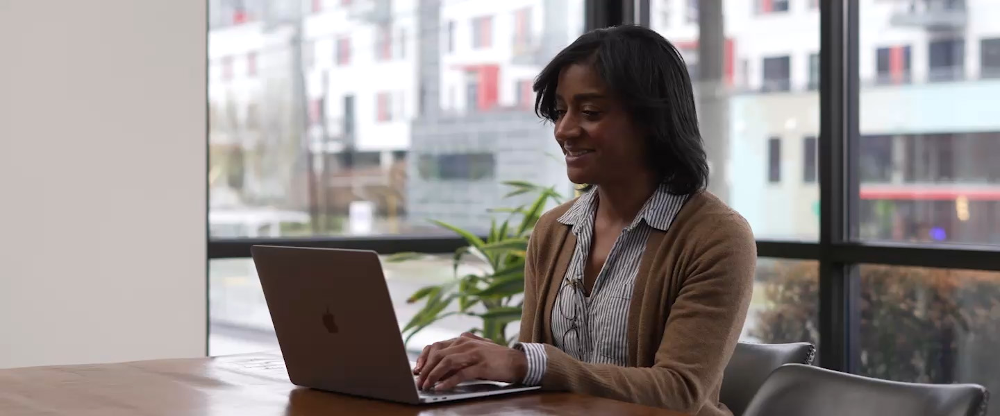 Video of people working on their computers in a coffee shop