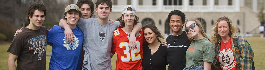 Students posing together on Belmont's lawn