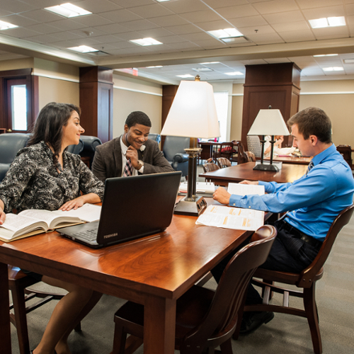Students gathered at a table in discussion